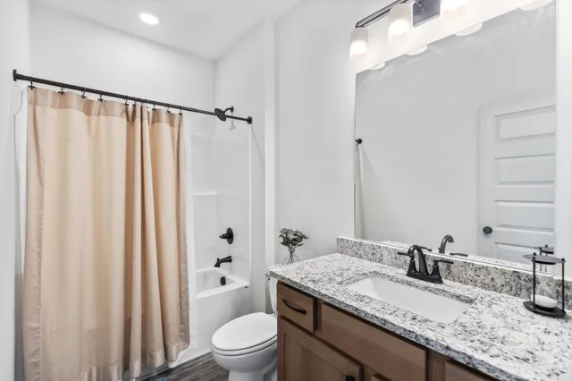 a aerial view of a house with a yard