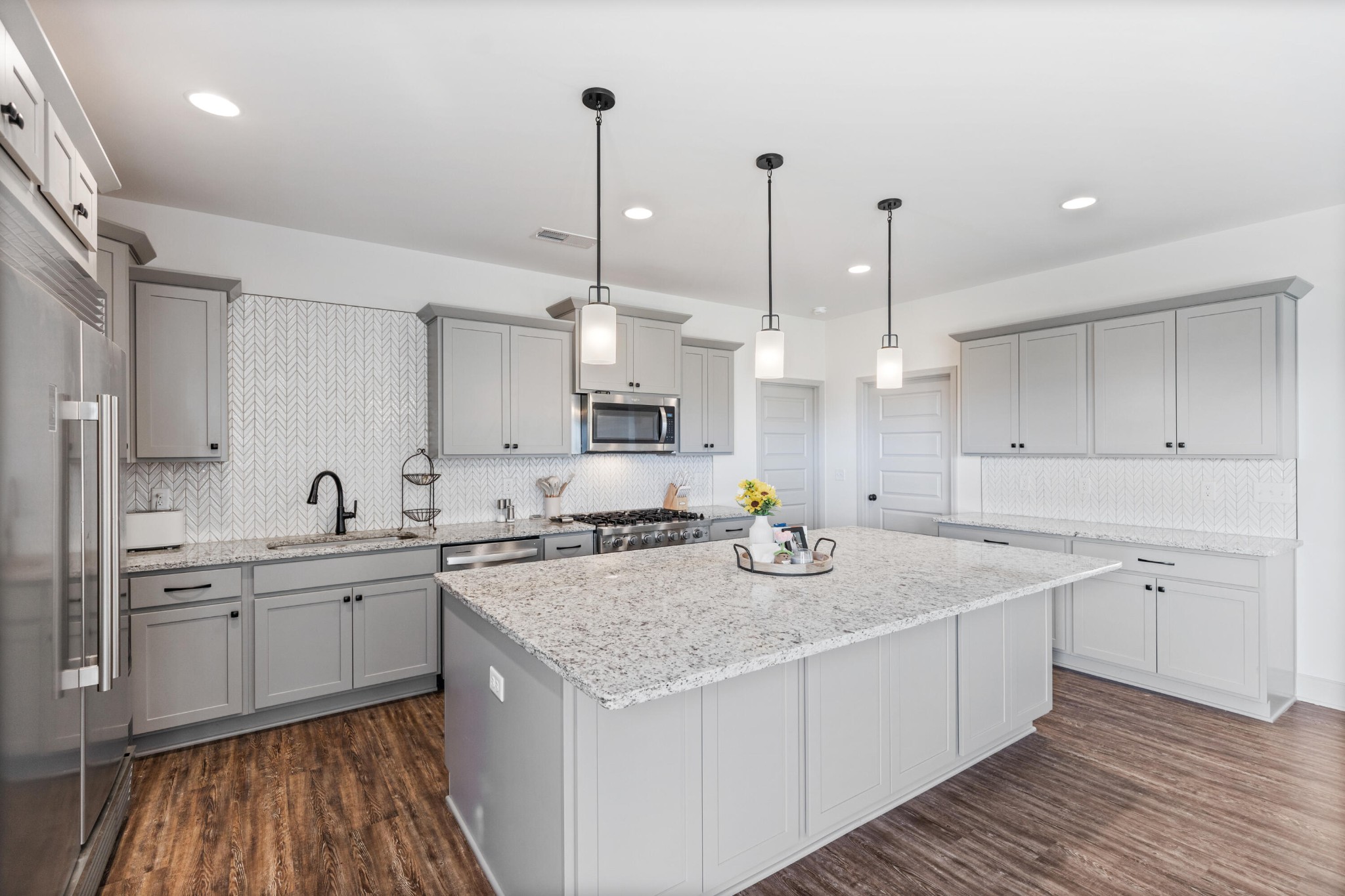 610 Summer City Firetower Road Pikeville, TN 37367 - Photo 7 of 60 a kitchen with stainless steel appliances granite countertop a sink a stove and a wooden floors