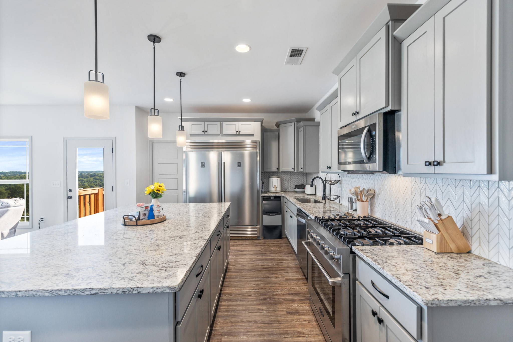 610 Summer City Firetower Road Pikeville, TN 37367 - Photo 8 of 60 a kitchen with granite countertop a sink a counter space and stainless steel appliances