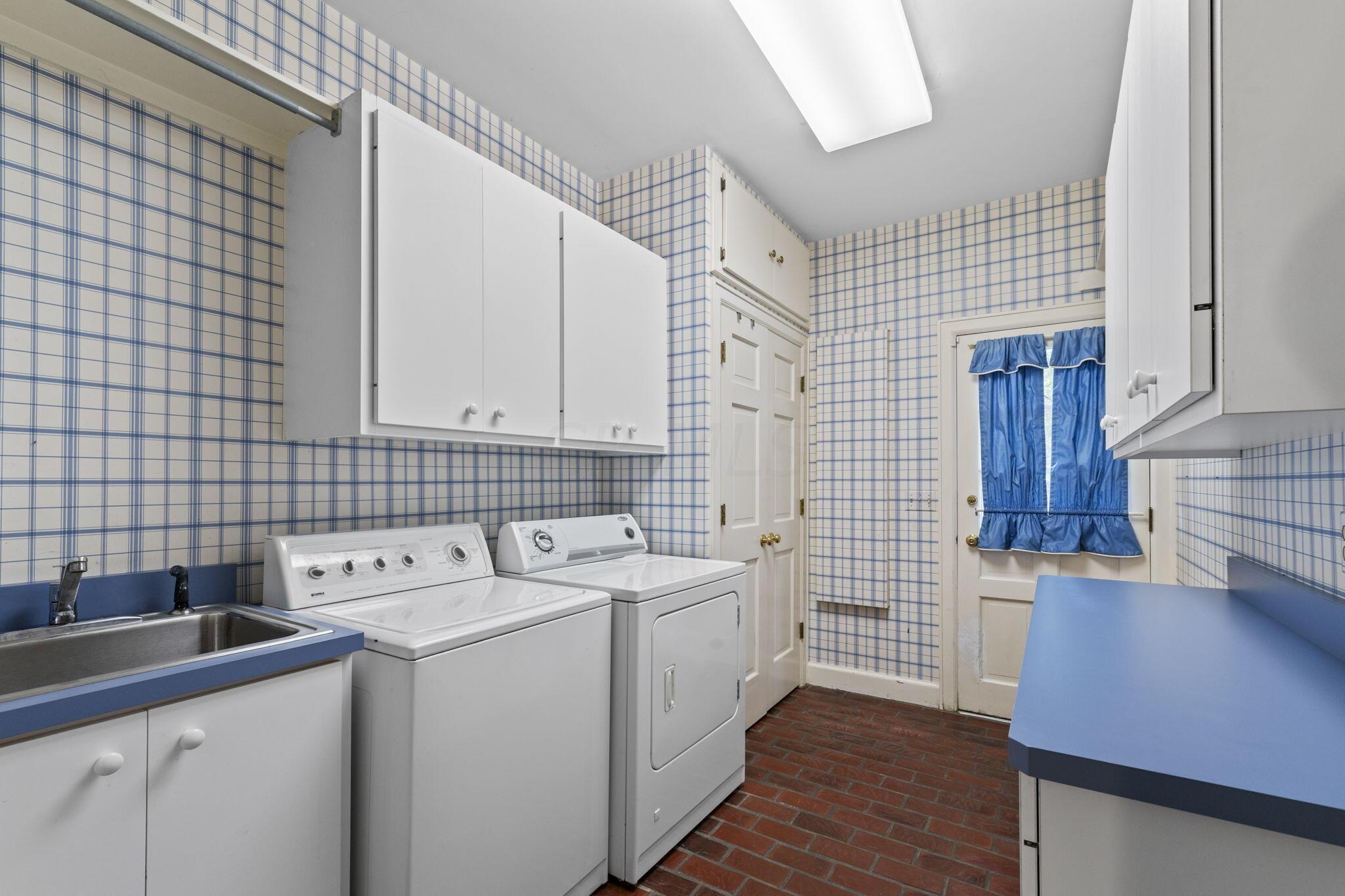 2111 Cheltenham Road Columbus, OH 43220 - Photo 26 of 64 Large utility room complete with door from the side of the home.