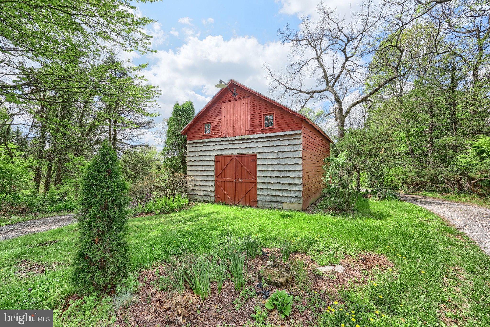 1974 Yingling Drive Spring Grove, PA 17362 - Photo 9 of 69 Charming rustic barn amidst greenery.