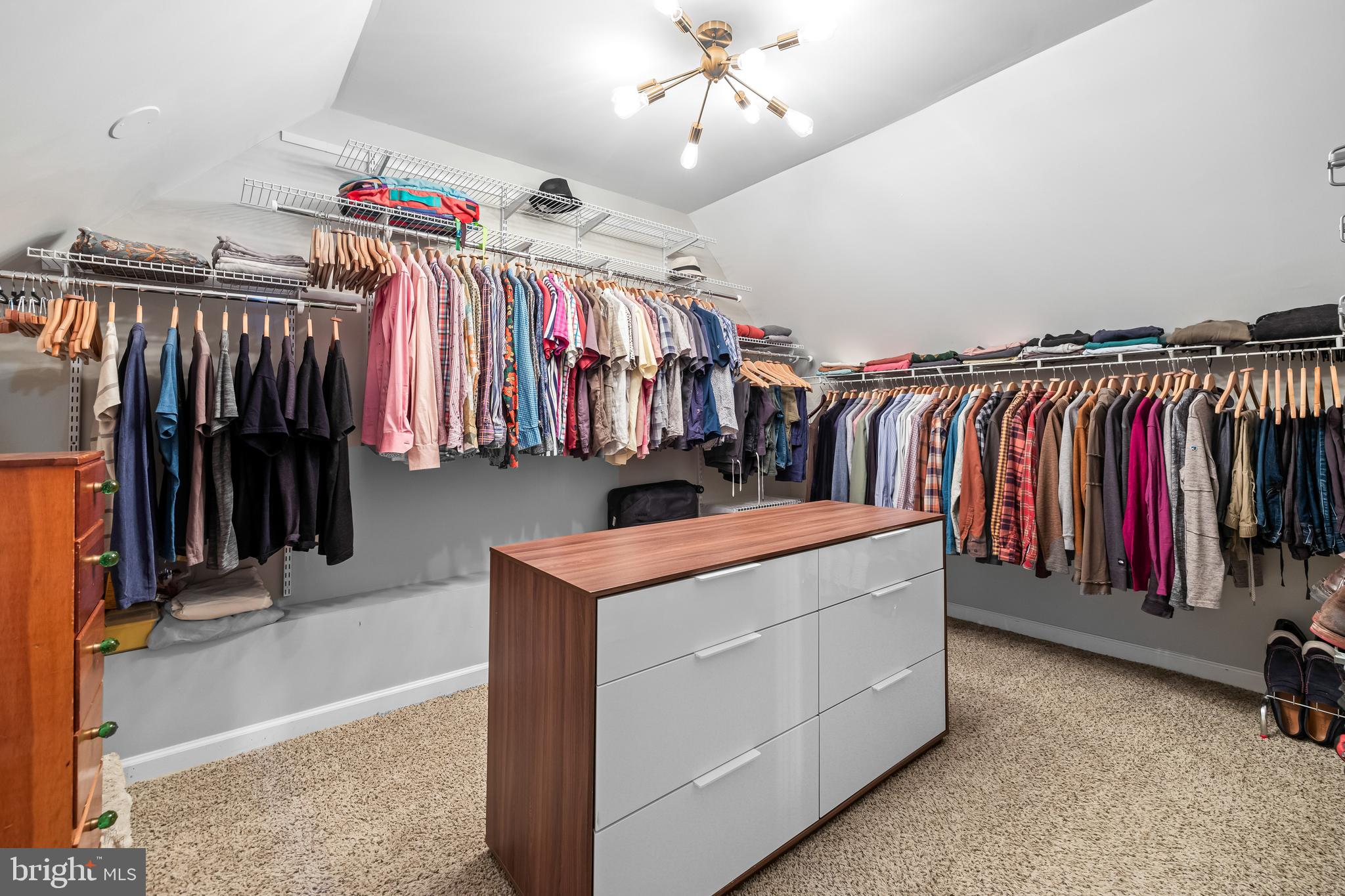4415 Norwood Road Baltimore, MD 21218 - Photo 68 of 83 a view of walk in closet with clothes and shoes