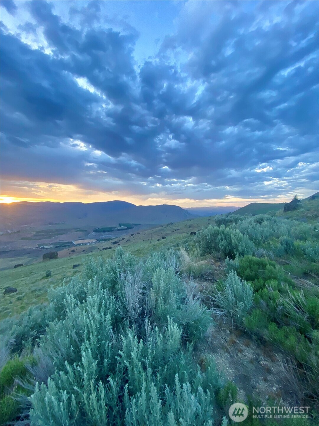 0 Northwest Peach Road Waterville, WA 98858 - Photo 12 of 12 a view of a yard with an outdoor space and deck