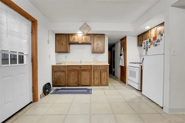 a kitchen with stainless steel appliances a refrigerator and a stove