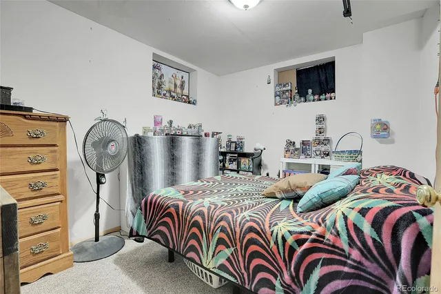 a bedroom with two beds and a flat screen tv