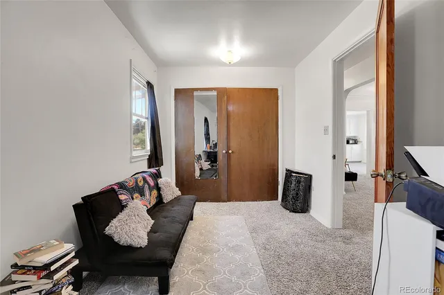 a bedroom with furniture and a dresser
