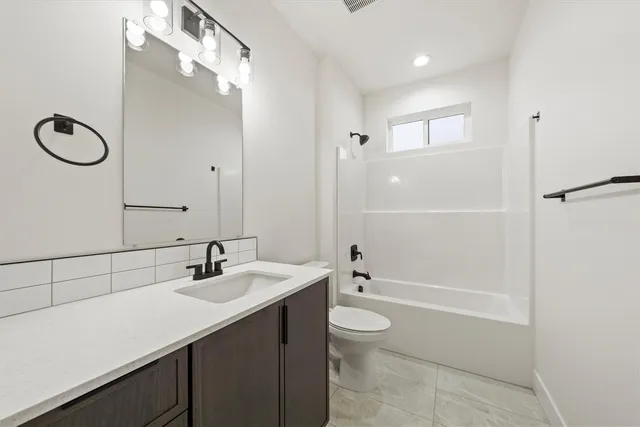 a view of storage and utility room with closet