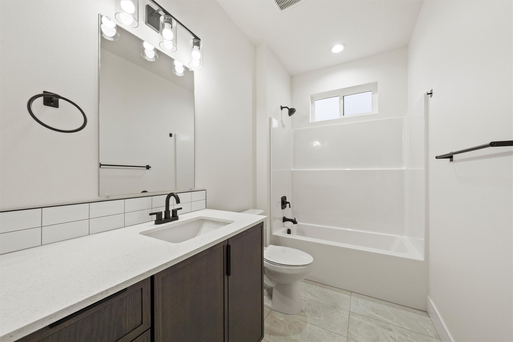1269 E Mount Othello, WA 99344 - Photo 19 of 32 a bathroom with a sink a toilet and shower