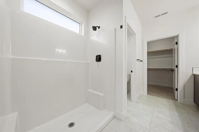 a view of an empty walk in closet