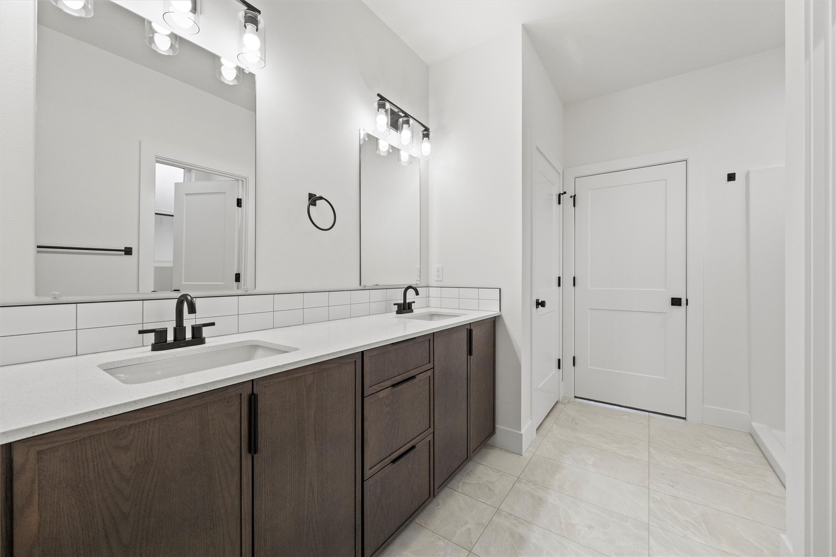 1269 E Mount Othello, WA 99344 - Photo 28 of 32 a bathroom with a double vanity sink and mirror