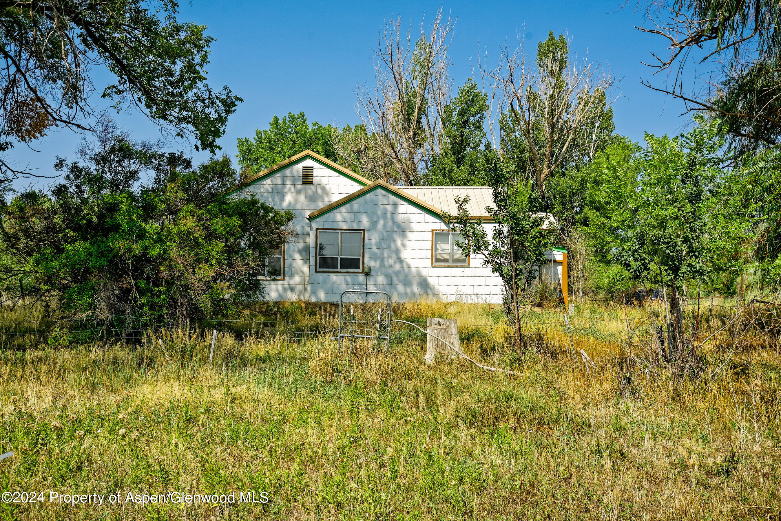 31145 Highway 6 Rifle, CO 81650 - Photo 19 of 25 a view of a house with a yard