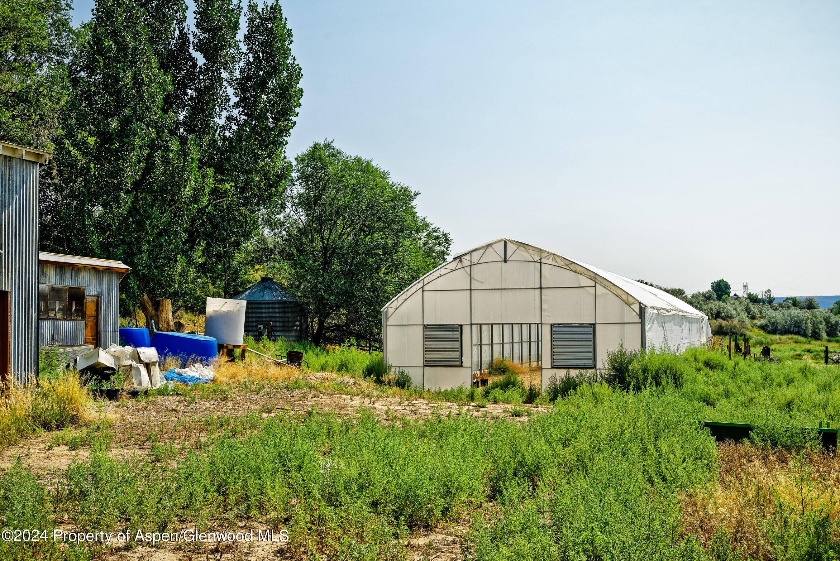 31145 Highway 6 Rifle, CO 81650 - Photo 4 of 25 a view of a house with a yard and sitting area