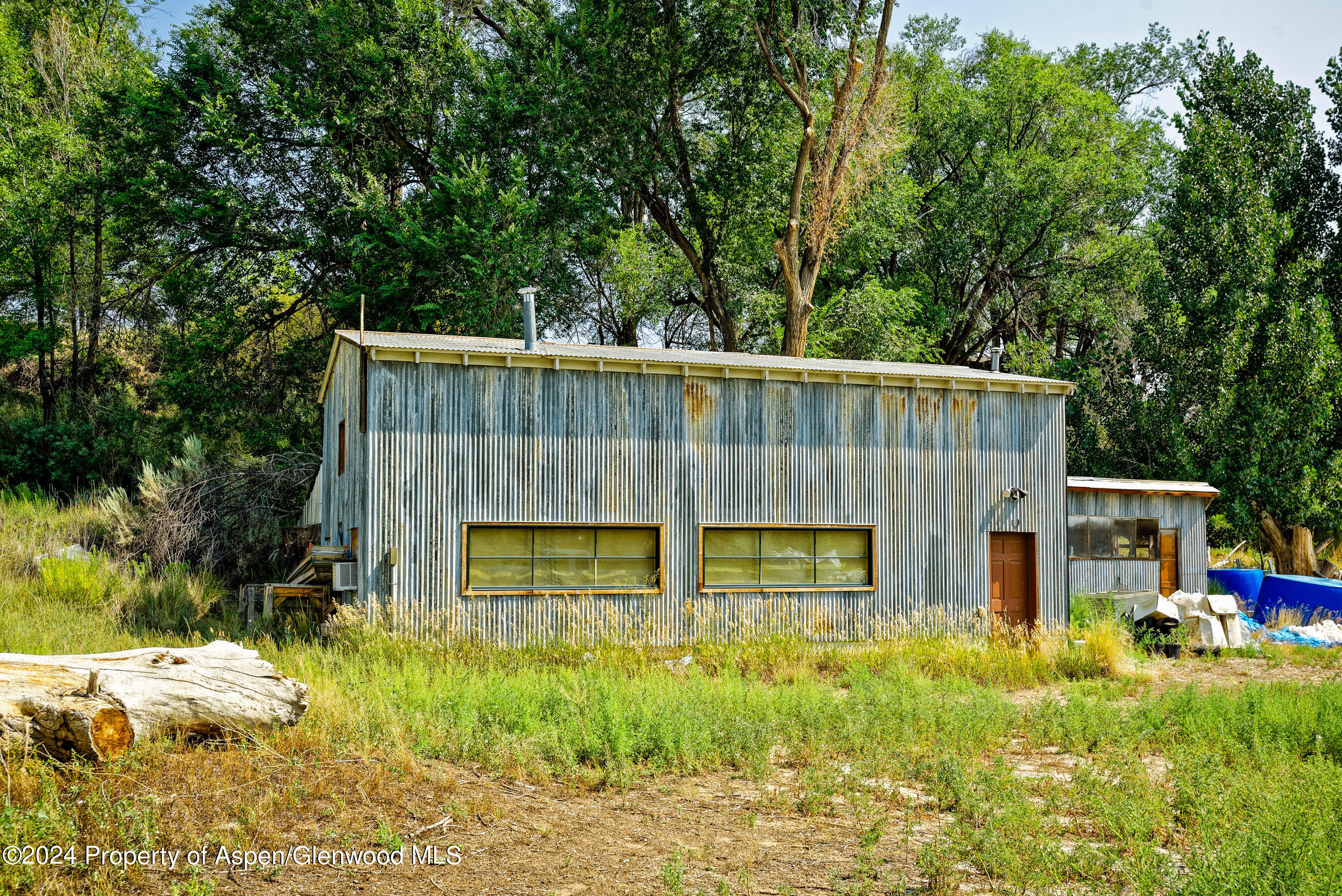 31145 Highway 6 Rifle, CO 81650 - Photo 6 of 25 a view of a house with backyard and garden