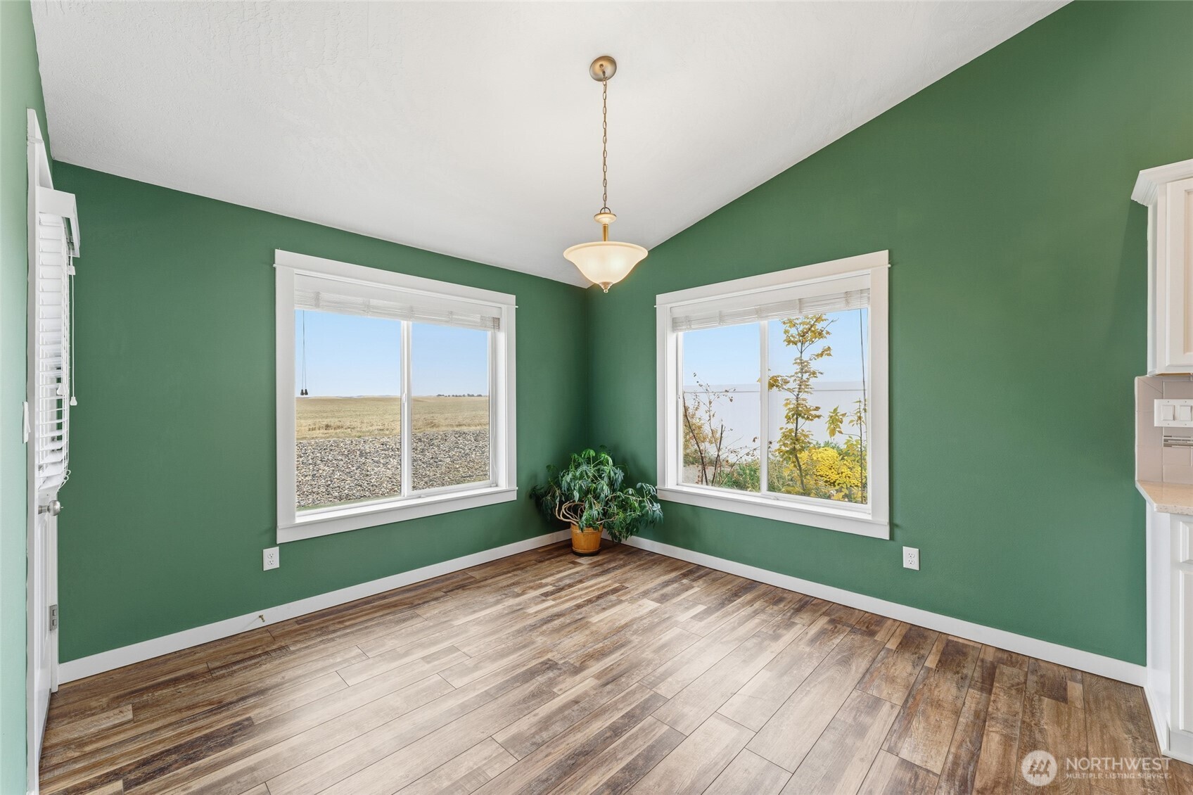 1339 Caprio Loop Walla Walla, WA 99362 - Photo 6 of 26 a view of an empty room with a window and wooden floor