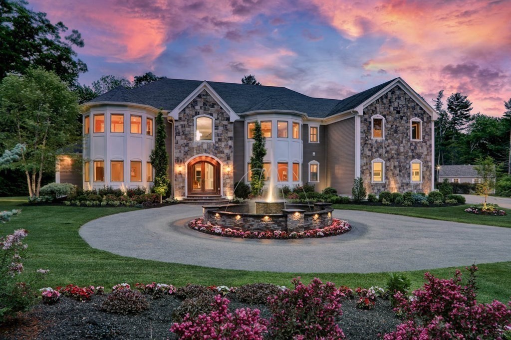 a front view of a house with a yard