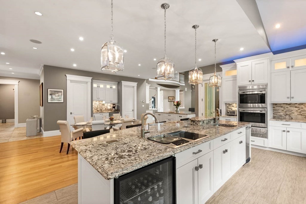 19 Ross Lane Middleton, MA 01949 - Photo 11 of 42 a kitchen with counter top space appliances and cabinets