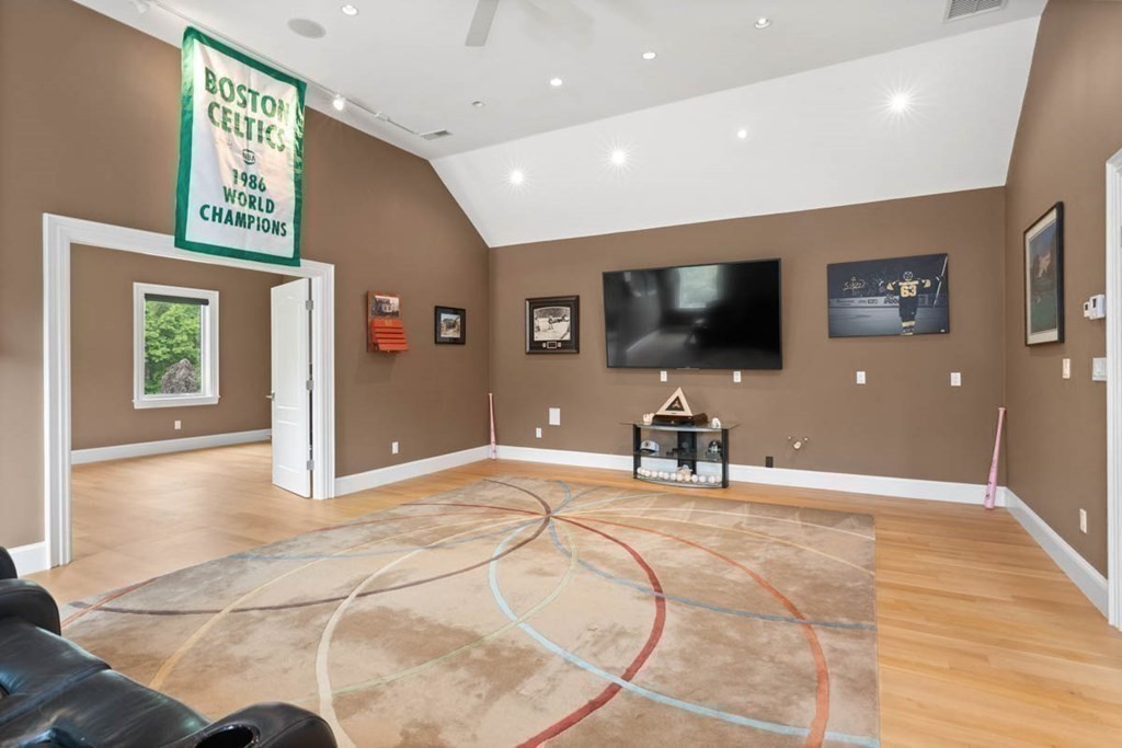 19 Ross Lane Middleton, MA 01949 - Photo 19 of 42 a view of a livingroom with a flat screen tv