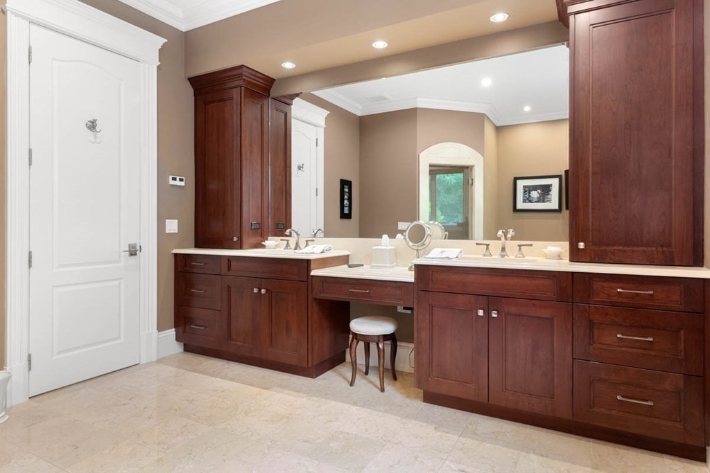19 Ross Lane Middleton, MA 01949 - Photo 22 of 42 a bathroom with a double vanity sink and a mirror