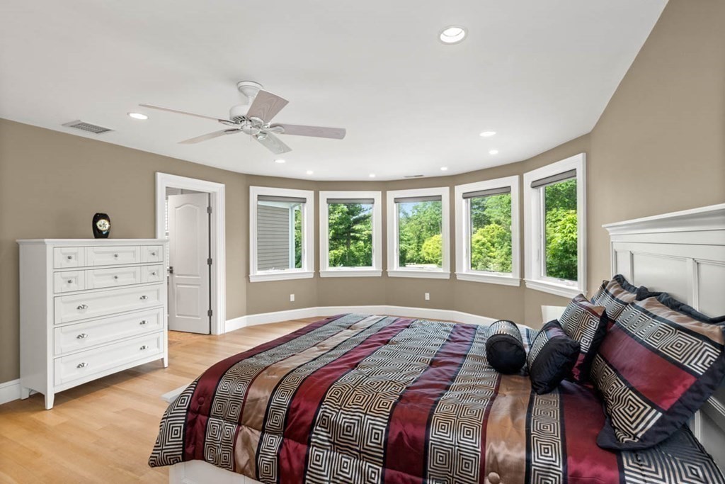 19 Ross Lane Middleton, MA 01949 - Photo 23 of 42 a bedroom with a bed and wooden floor