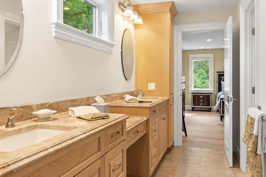 19 Ross Lane Middleton, MA 01949 - Photo 26 of 42 a bathroom with a sink and a mirror