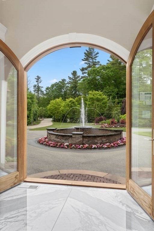 19 Ross Lane Middleton, MA 01949 - Photo 29 of 42 a view of a living room and a floor to ceiling window