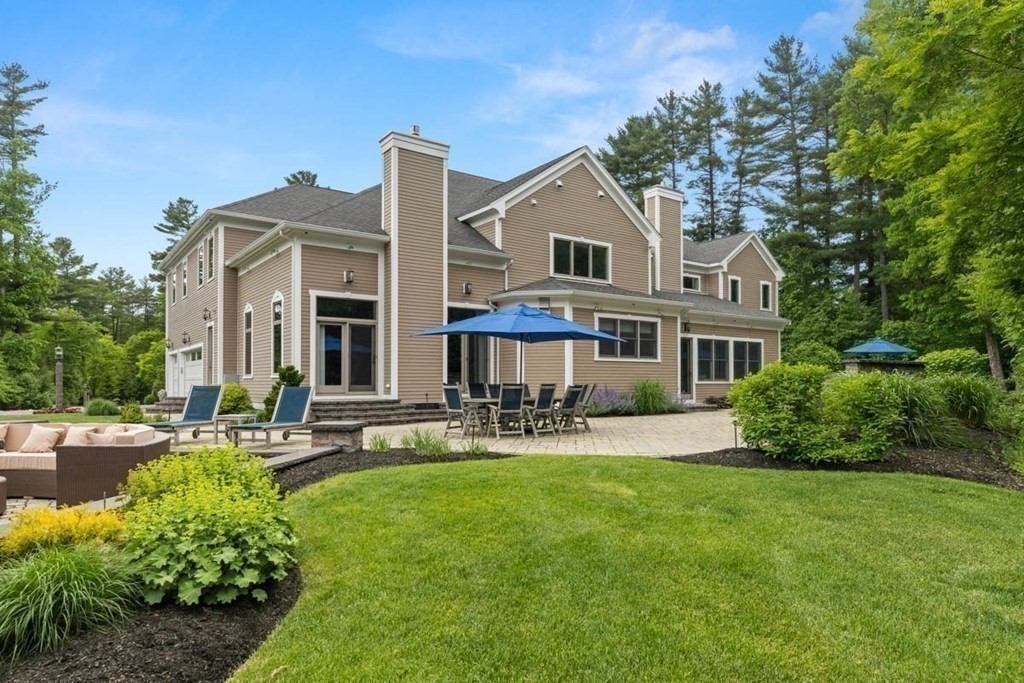 19 Ross Lane Middleton, MA 01949 - Photo 30 of 42 a front view of a house with swimming pool and sitting area