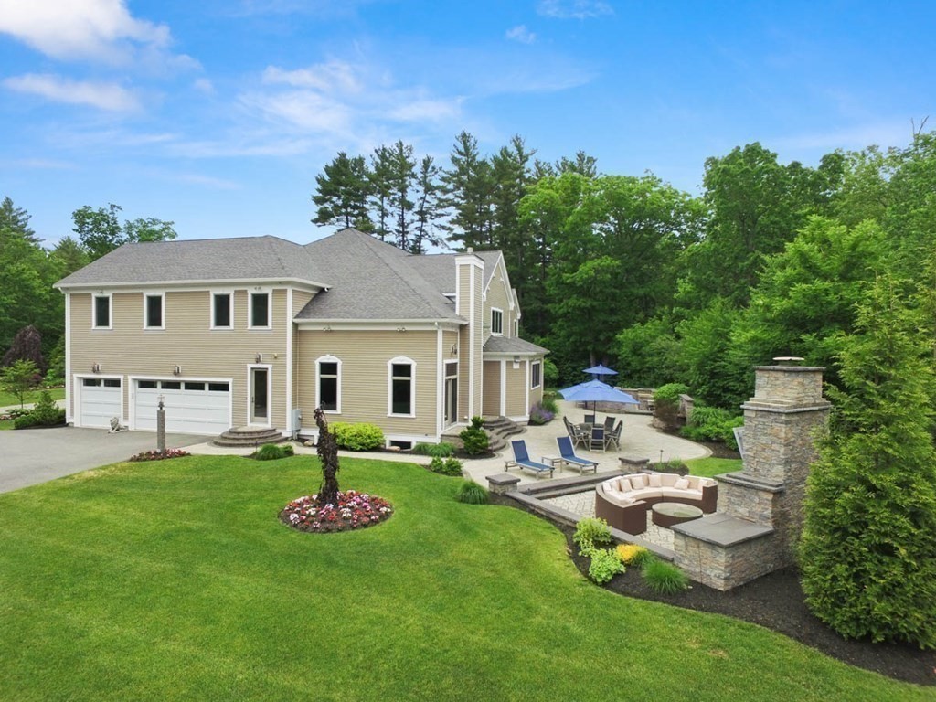 19 Ross Lane Middleton, MA 01949 - Photo 31 of 42 a view of a house with backyard sitting area and garden