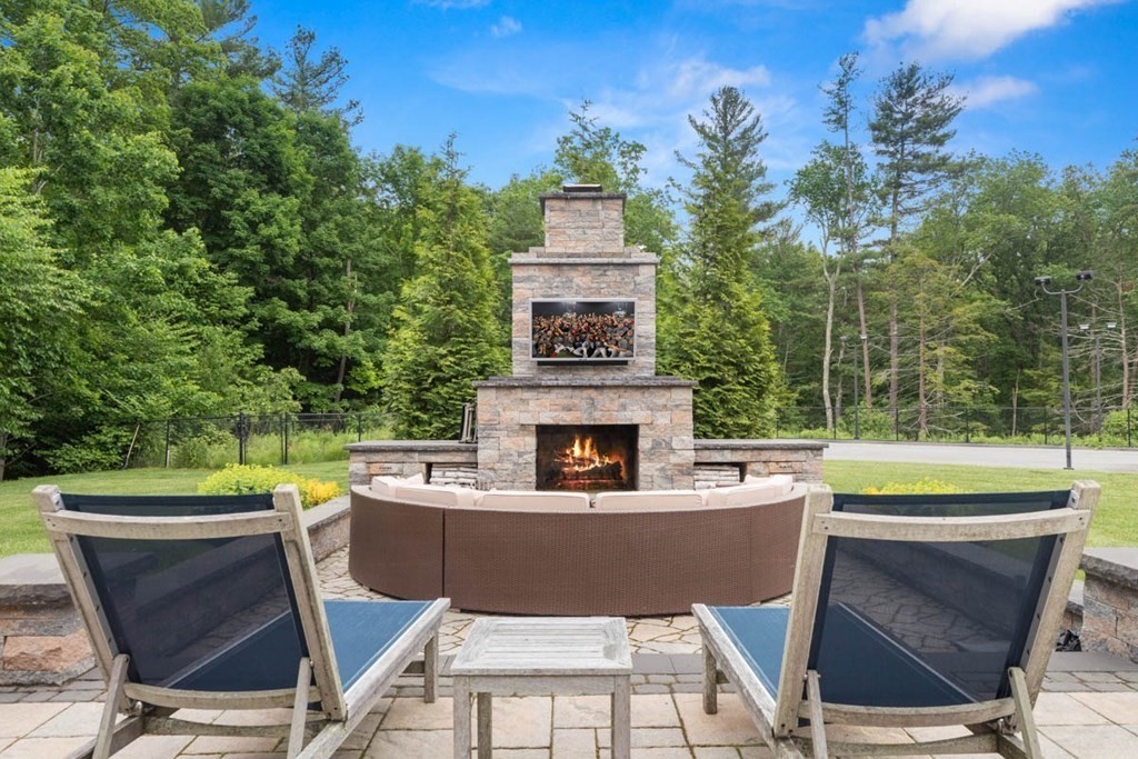 19 Ross Lane Middleton, MA 01949 - Photo 32 of 42 a view of a chairs and table in the patio