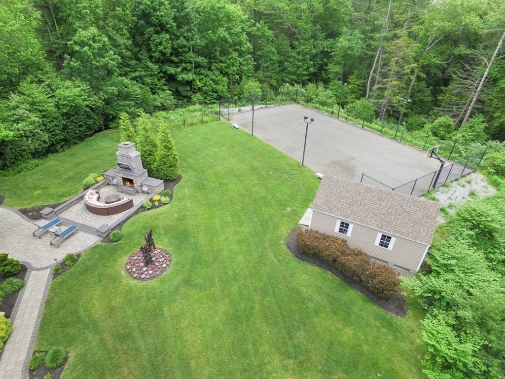 19 Ross Lane Middleton, MA 01949 - Photo 38 of 42 a view of a table and chairs in backyard