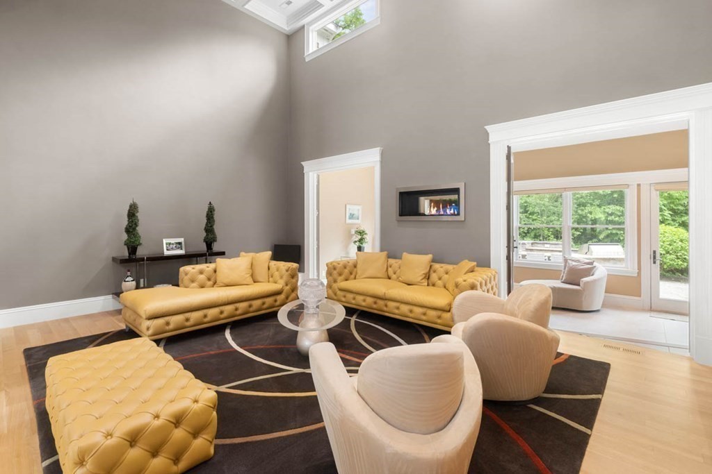 19 Ross Lane Middleton, MA 01949 - Photo 5 of 42 a living room with furniture and a large window
