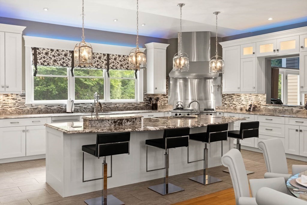 19 Ross Lane Middleton, MA 01949 - Photo 10 of 42 a kitchen with a sink and chairs