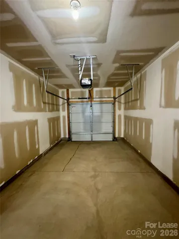 a large kitchen with stainless steel appliances granite countertop a stove a sink and a refrigerator