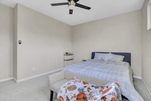 a bedroom with a bed and window