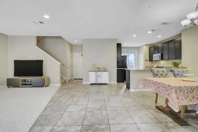a view of kitchen with furniture and flat screen tv