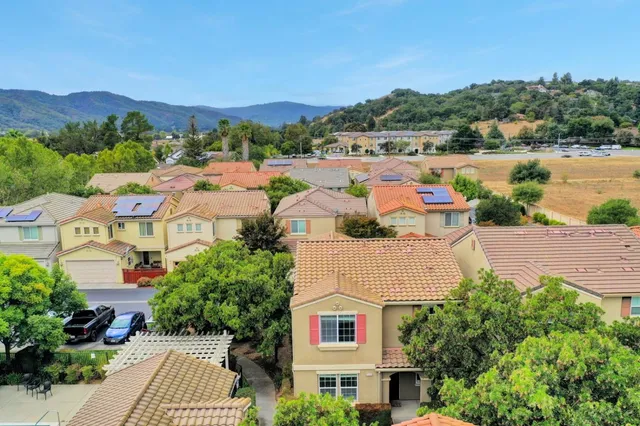 an aerial view of residential house and sandy dunes