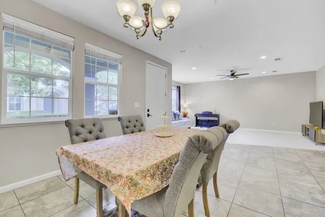 a bed room with a bed and a chandelier