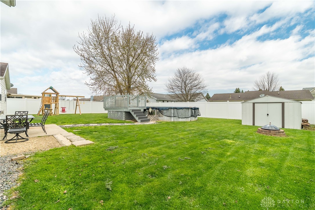 1442 Langdon Road Sidney, OH 45365 - Photo 30 of 34 This spacious backyard offers ample room for recreation and outdoor enjoyment.