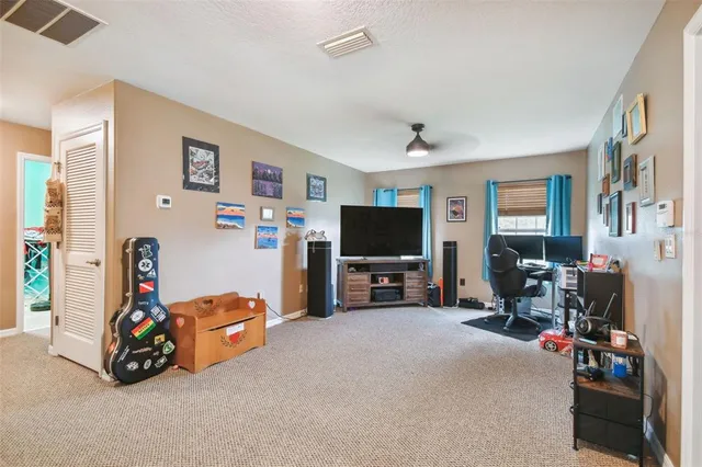a view of a livingroom with furniture and a flat screen tv