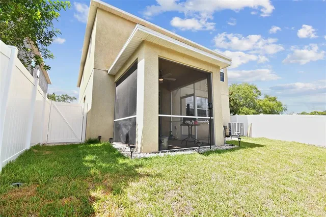 a view of front door and yard