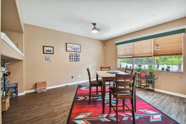 a view of a dining room with furniture window and wooden floor