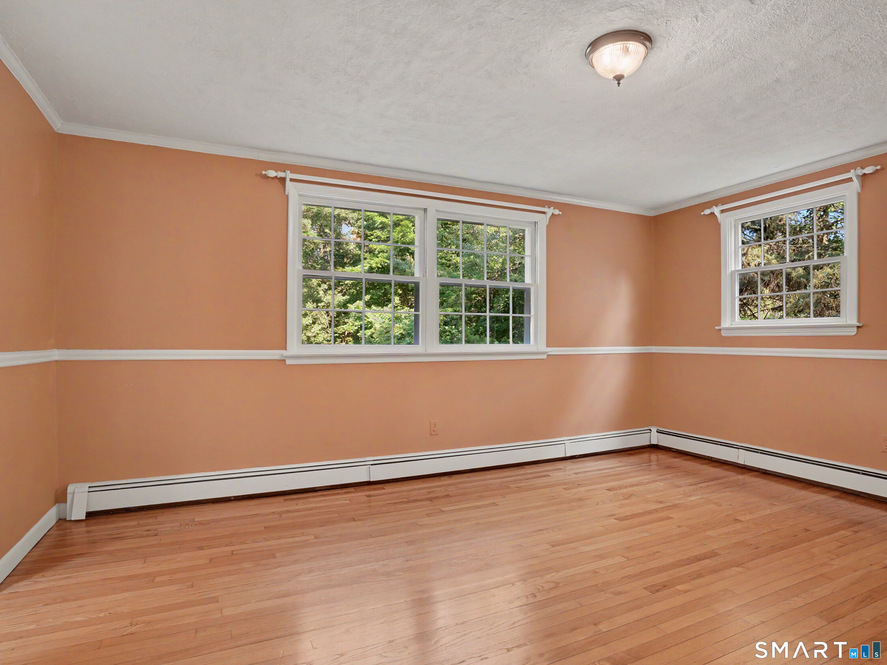 15 Flat Rock Drive Ridgefield, CT 06877 - Photo 11 of 39 an empty room with wooden floor and windows