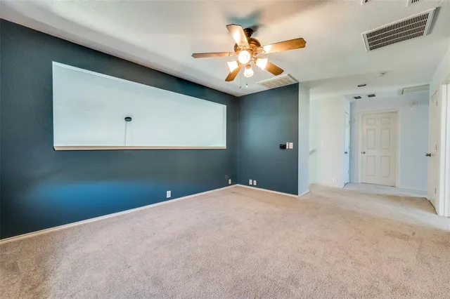 a view of a livingroom with a fan