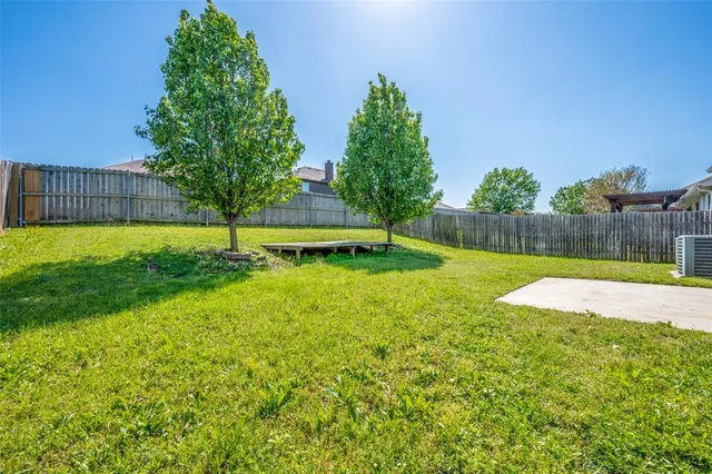 a view of a backyard with a small pool