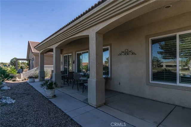 a view of house with patio outdoor seating space