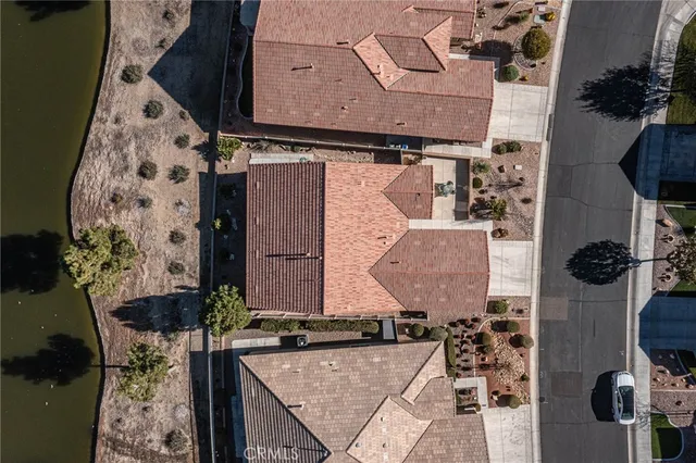 an aerial view of a house with outdoor space