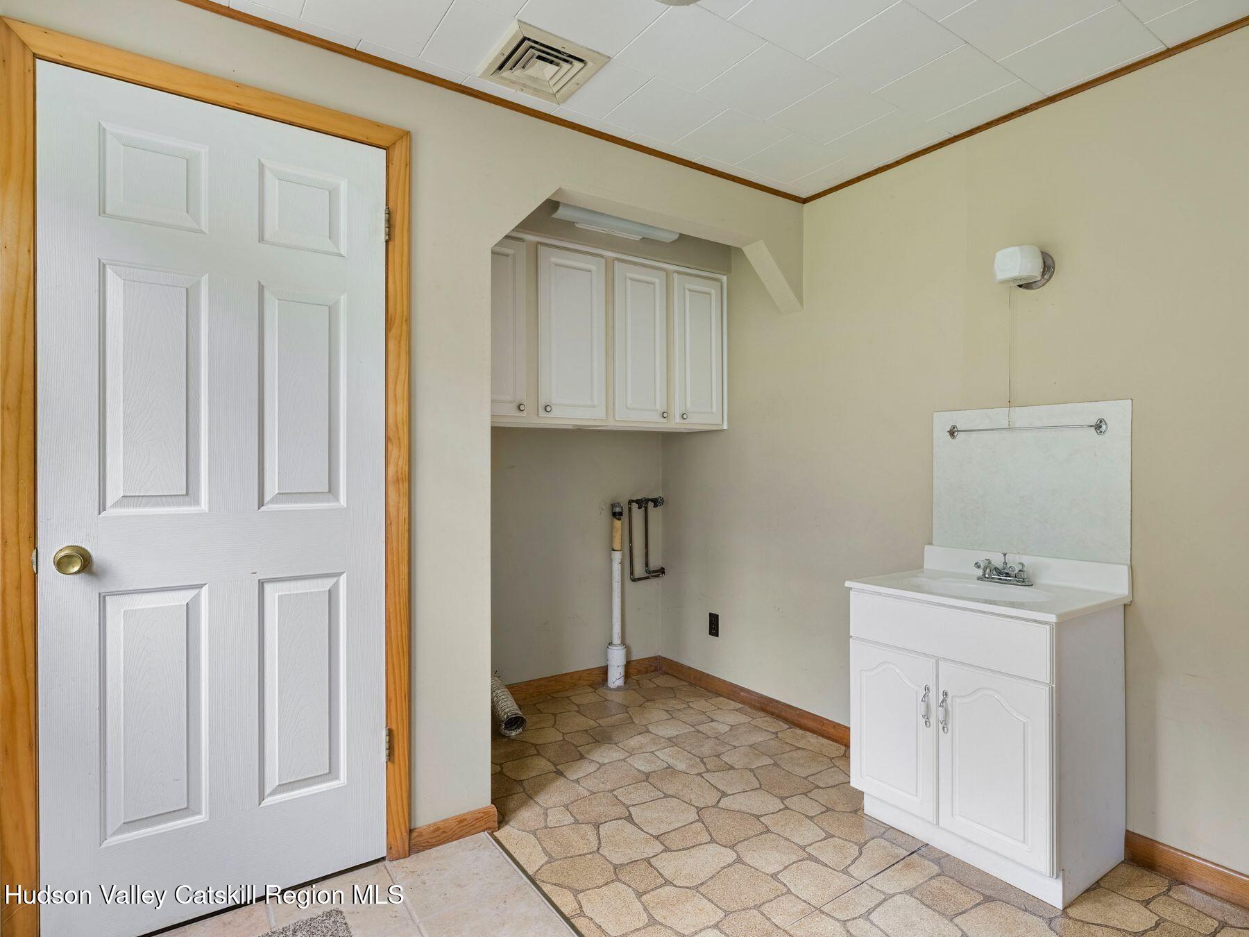 169 Mattice Road Prattsville, NY 12468 - Photo 21 of 52 a room with a stove and a cabinet