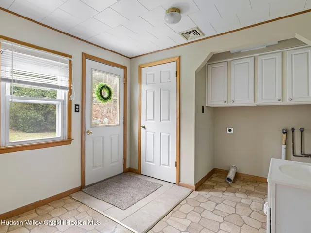 a bathroom with a shower a toilet and a sink