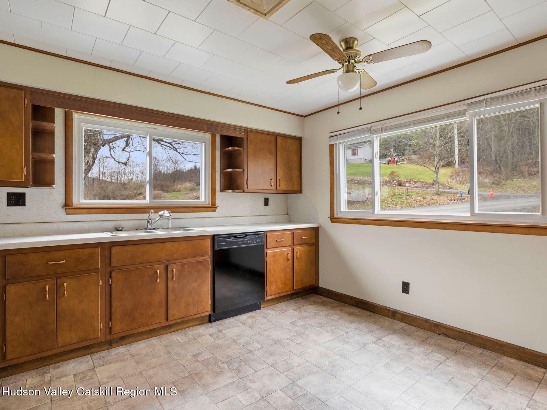 169 Mattice Road Prattsville, NY 12468 - Photo 27 of 52 a large kitchen with stainless steel appliances granite countertop a stove a sink and a granite countertops with cabinets