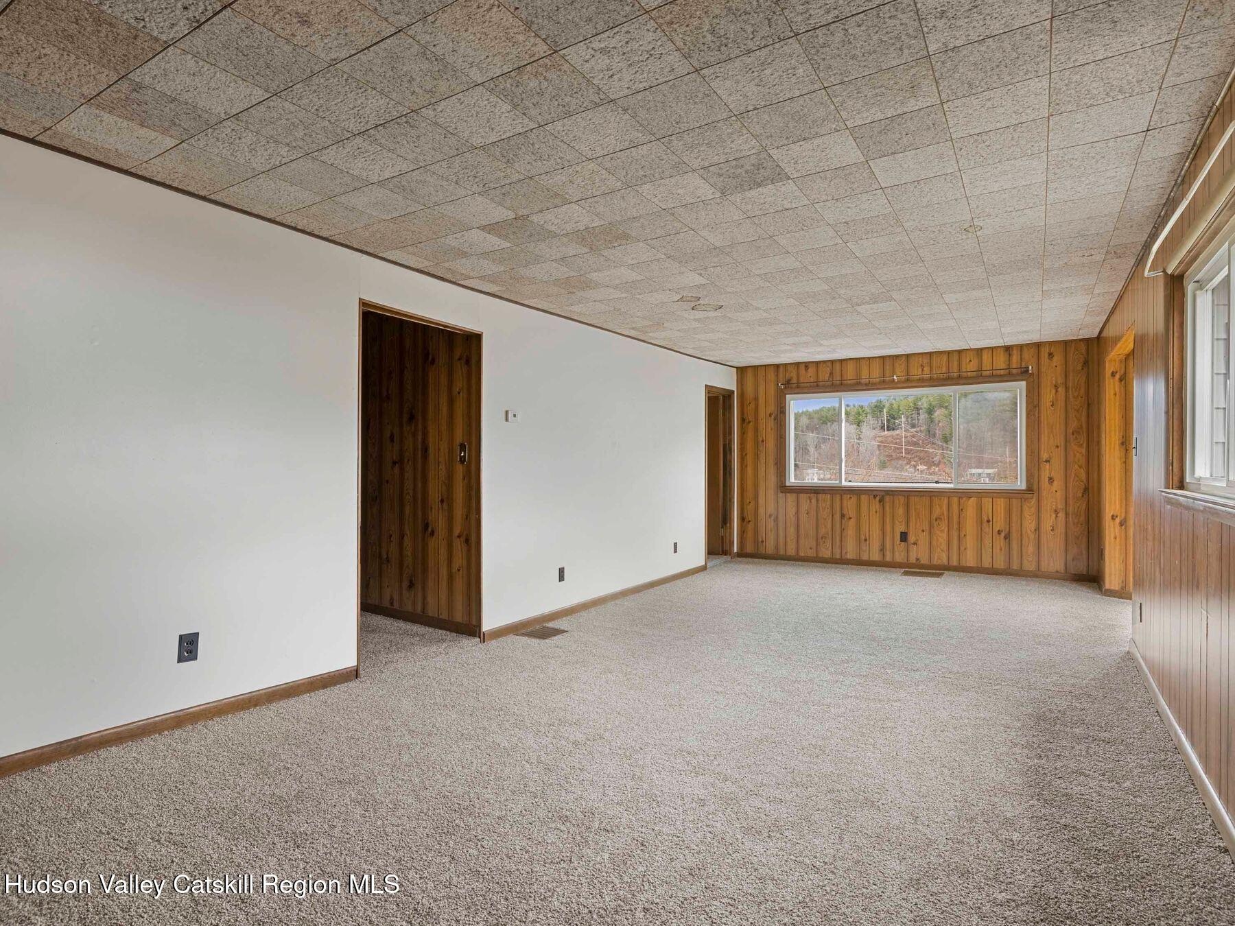 169 Mattice Road Prattsville, NY 12468 - Photo 29 of 52 a view of an empty room with a window