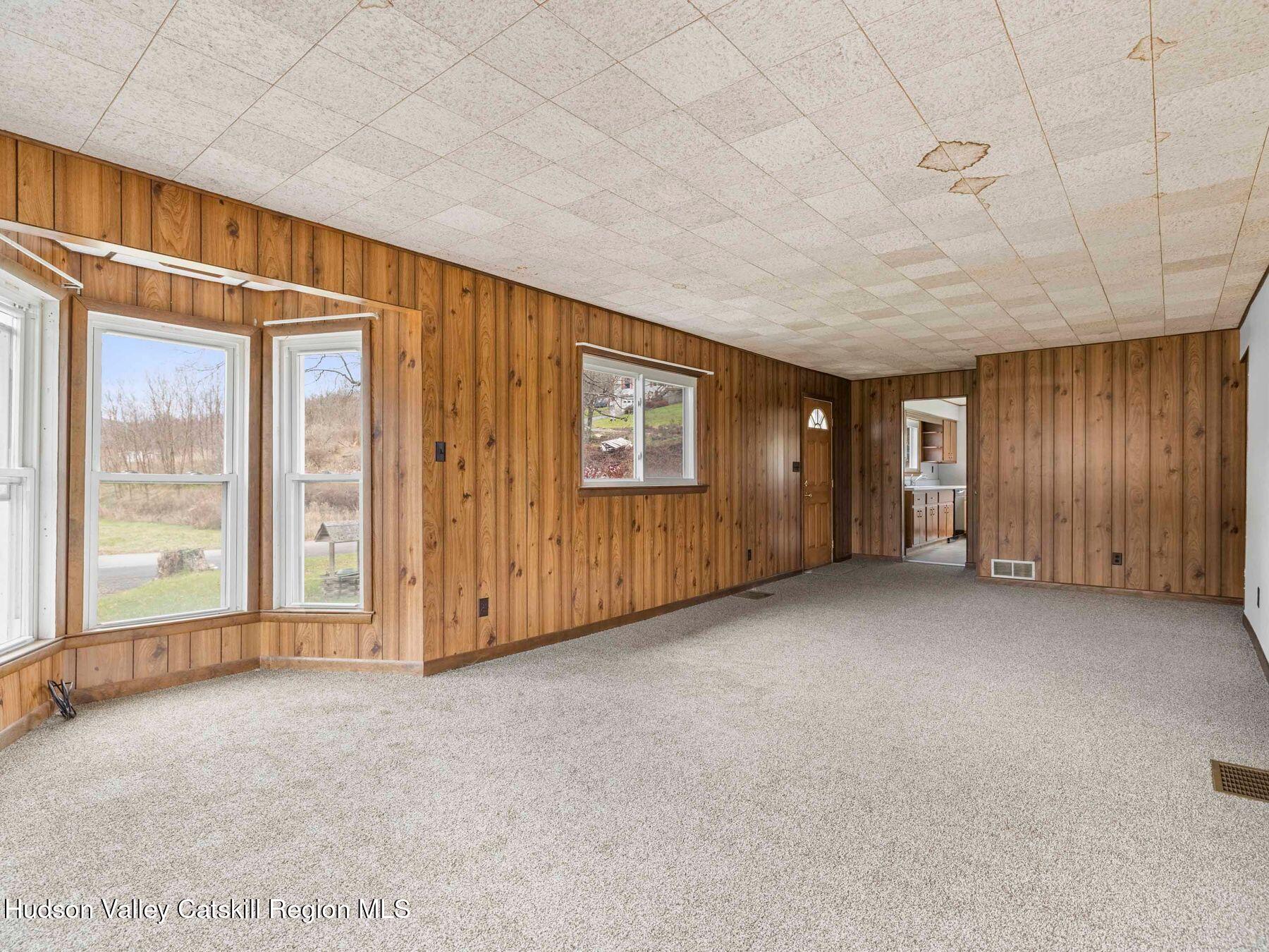 169 Mattice Road Prattsville, NY 12468 - Photo 31 of 52 a view of an empty room with a window